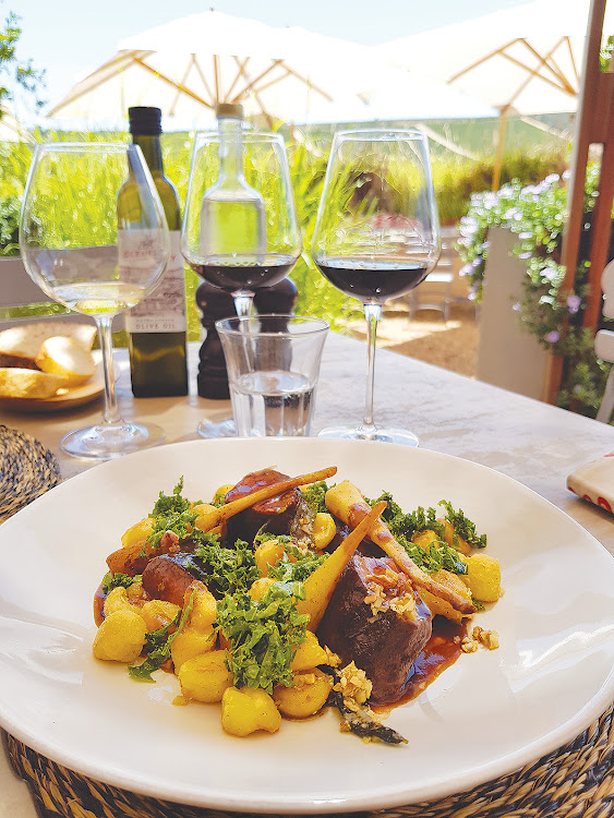 Th Vino Bistro's tender springbok loin surrounded by light and herby gnocchi Parisienne and a fresh, crunchy kale and almond salad.