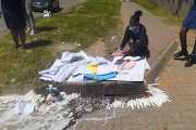 Phomolong Secondary School pupils place candles and hand-written cards at the spot where their deputy principal Thembisile Ngendane was shot dead on Friday.