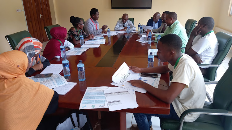 Adolescent advocacy champions meet the county assembly budget committeee chair Manza Beja and Health committee vice chair Tumaini Mwachaunga at Kwale assembly in Matuga sub-county on Thursday, March 14, 2024.