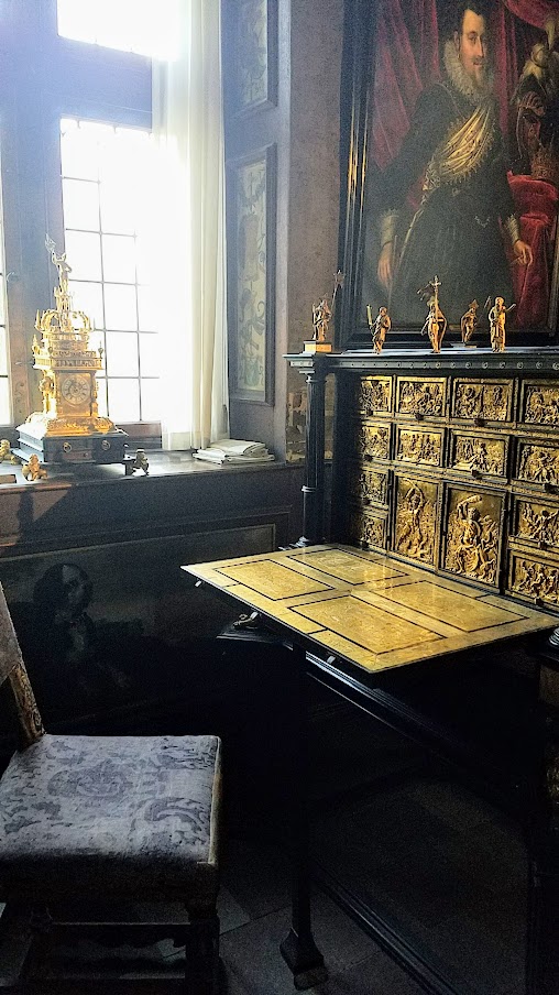 Visiting Rosenborg Castle in Copenhagen, offering 400 years of history particularly artifacts and stories from one of Denmark's most colorful kings, Christian IV. The small and thus easy to heat Christian IV’s Writing Room, preserved more or less intact, including the ornate gold writing table.