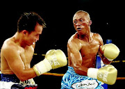 Julius Alcos in the ring with Gideon Buthelezi who will   defend his IBO junior bantamweight belt against Ryan Rey Ponteras from the Philippines tonight. / ANTONIO MUCHAVE