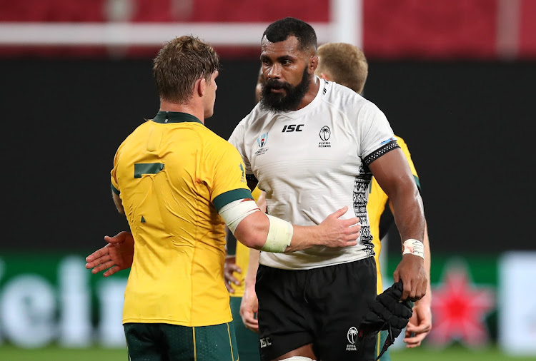 Australia's Michael Hooper greets Fiji's Semi Radradra after a past match match