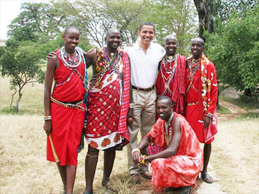 US President Obama (in white shirt) with Maasai morans when he visited Kenya in 2015. Photo/FILE