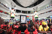 Fans wait for the South African national football team's arrival at OR Tambo International Airport on February 14 2024.