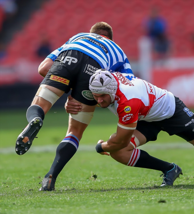 Len Massyn of the Xerox Golden Lions tackles Chris van Zyl (c) of the DHL WP during the Currie Cup match at Emirates Airline Park on September 15, 2018 in Johannesburg, South Africa.