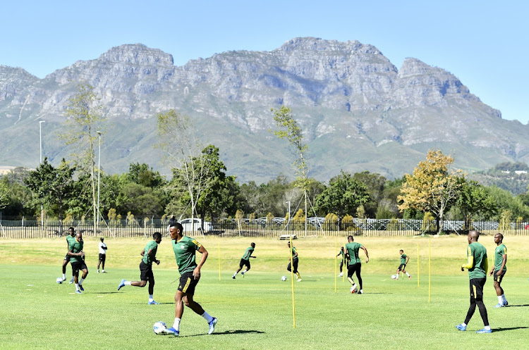 Bafana defender Mothobi Mvala, seen here warming up with the national men's soccer team media at Lentelus Sportsground in Stellenbosch on Monday, is almost certain to miss Afcon