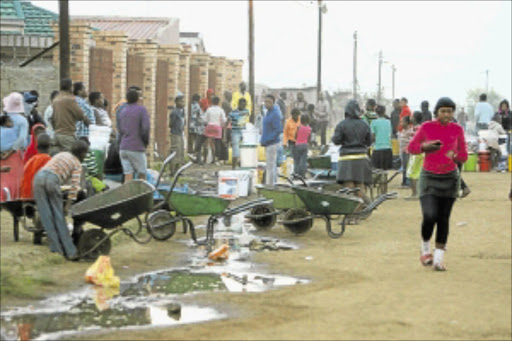 WAITING: People stand in queues for water in Silobela township in Carolina, Mpumalanga. PHOTO: MABUTI KALI