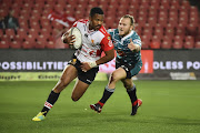 Sylvian Mahuza of the Golden Lions gets away from Christiaan Meyer of Griquas during the Currie Cup match at Emirates Airline Park on August 24, 2018 in Johannesburg, South Africa.