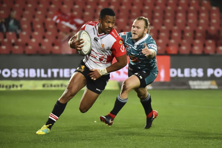 Sylvian Mahuza of the Golden Lions gets away from Christiaan Meyer of Griquas during the Currie Cup match at Emirates Airline Park on August 24, 2018 in Johannesburg, South Africa.