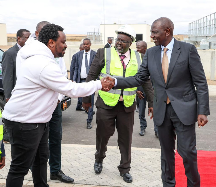 President William Ruto greets a man at Konza Technopolis City in Makueni County on August 3, 2023.