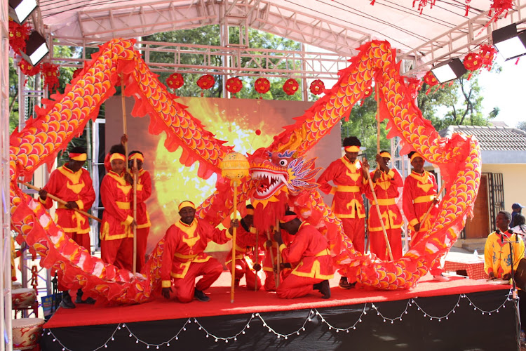 Confucius Institute at the University of Nairobi students perform a dragon dance during 'The Dragon is soaring and the drums are rolling for the Chinese New Year' event at their campus on February 7, 2024