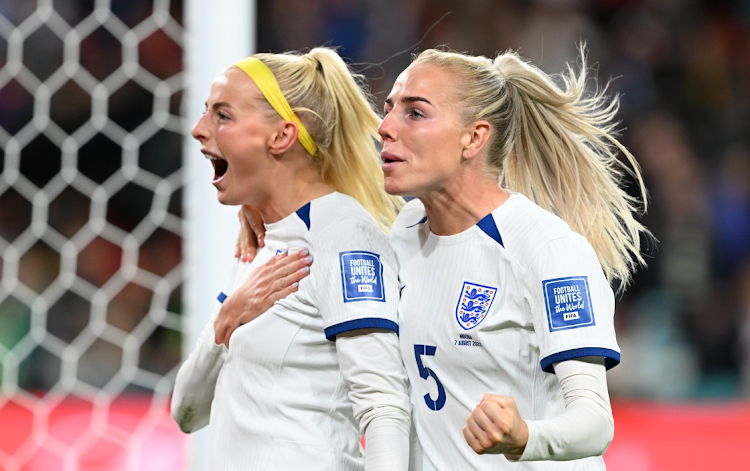 Chloe Kelly (left) of England celebrates with teammate Alex Greenwood after scoring her team's fifth and winning penalty in the shoot-out against Nigeria in their Women's World Cup last 16 match at Brisbane Stadium on August 7 2023.