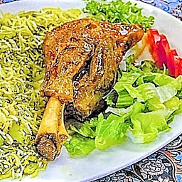 Persian Lamb Shank Slow Cooked with Rice and side of vegetables