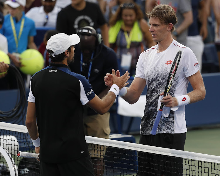 Kevin Anderson of South Africa (right) greets Jeremy Chardy of France after a second round match on day three of the 2018 US Open tennis tournament at USTA Billie Jean King National Tennis Center August 29, 2018 in New York.