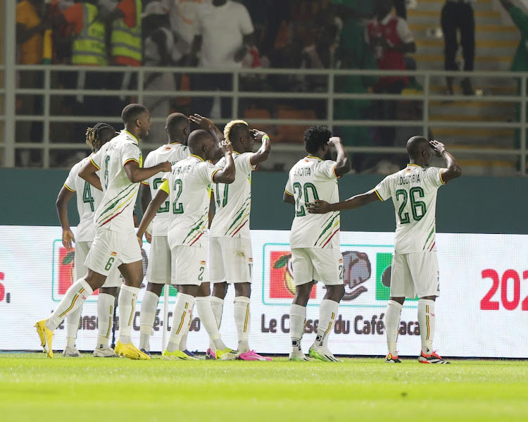 Mauritania players celebrate after qualifying to the round of 16.