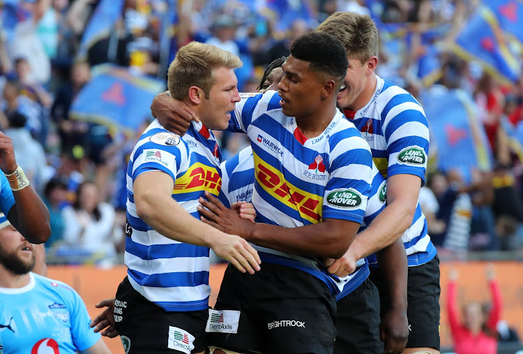 Paul de Wet of Western Province celebrates scoring a try with teammate Damian Willemse during the Currie Cup semifinal match against the Blue Bulls at Newlands Stadium in Cape Town on October 20, 2018.