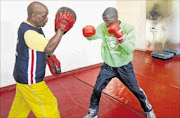 HURTING: 
      
       Nkosinathi Joyi, left, lost  his IBF minimumweight title to Mario Rodriguez in Mexico.
      
      
      
      PHOTO: MLONDOLOZI MBOLO