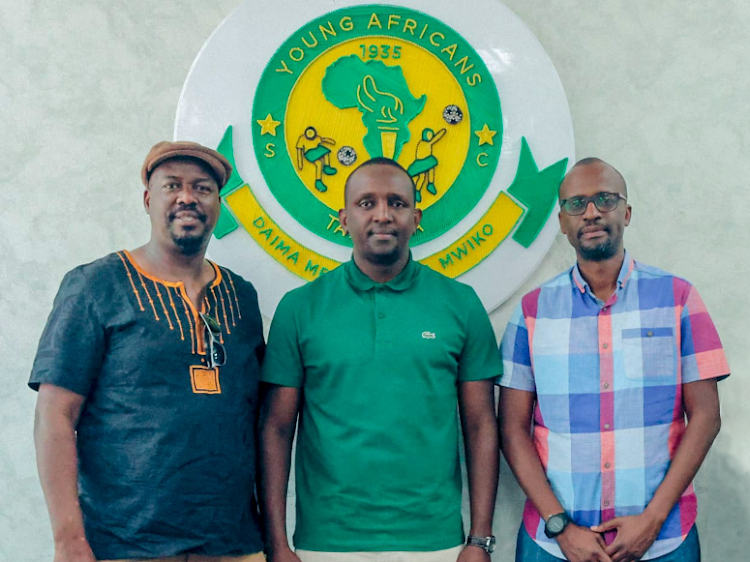 Gor Mahia Fc Secretary General Sam Ochola(L), Gor Mahia CEO Raymond Oruo(R) and Yanga SC President Hersi Said (C) pose for a photo after meeting in Tanzania