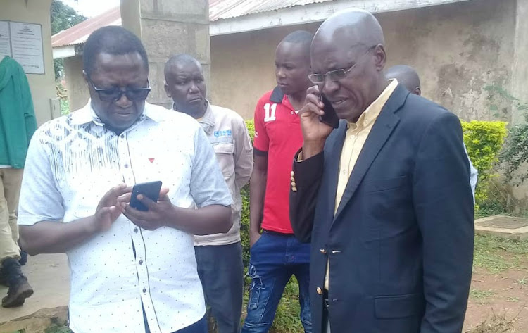 Ikolomani MP Benard Shinali condoles with former Kakamega senator Boni Khalwale at Mukumu mission hospital mortuary where the body of Adelaide Khalwale lies on Saturday, October 5, 2019.