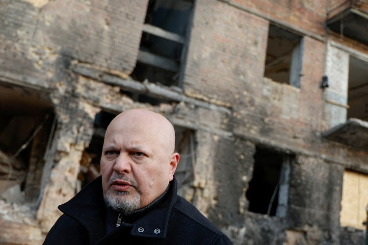 International Criminal Court prosecutor Karim Khan visits a residential building damaged by a Russian missile strike late November in the town of Vyshhorod, outside Kyiv, Ukraine, February 28 2023. Picture: VALENTYN OGIRENKO/ REUTERS