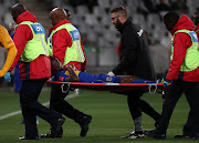 Teko Modise of Cape Town City leaves the field injured during the Absa Premiership 2017/18 football match between Cape Town City FC and Kaizer Chiefs at Cape Town Stadium, Cape Town on 13 September 2017.