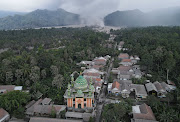 An aerial view of Sumber Wuluh village covered with volcanic ash following the eruption of Mount Semeru volcano in Lumajang regency, East Java province, Indonesia, December 5, 2021. Picture taken with a drone. 