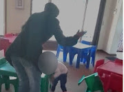 A video of a child being hit by a teacher because she vomited has caused outrage on social media.