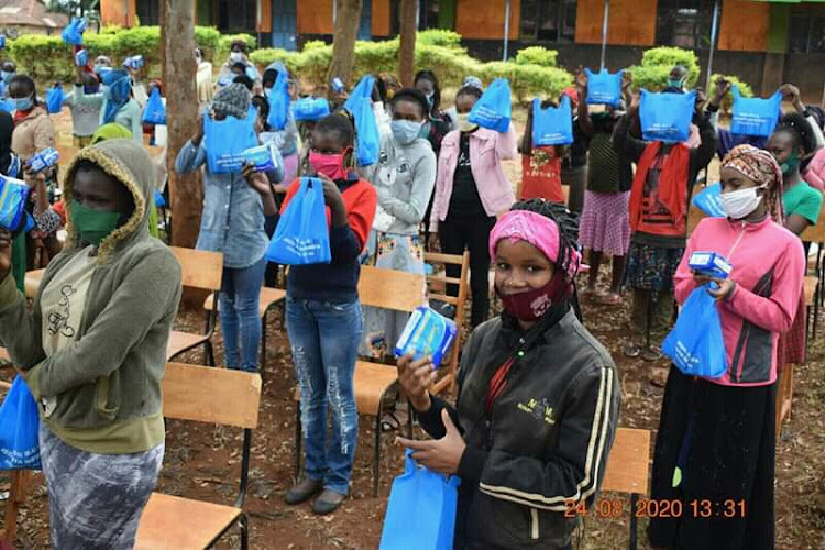 Mjini Primary School girls after receiving sanitary towels from Township MCA Jecinta Ng'ang'a on Monday