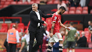 Ole Gunnar Solskjaer, Manager of Manchester United with Bruno Fernandes after the Premier League match between Manchester United and Aston Villa at Old Trafford on September 25, 2021 in Manchester, England.