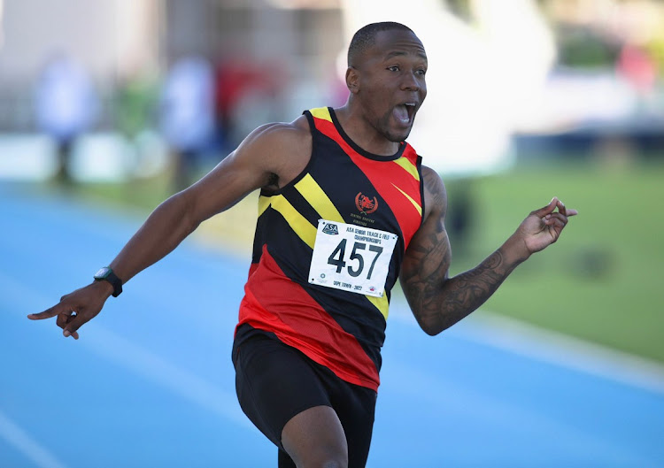 Akani Simbine from AGA wins the 100m men's race on day one of the ASA Senior Track and Field National Championships at Green Point Athletics Stadium in Cape Town on April 21 2022.