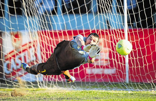 Bafana Bafana's stand-in captain Wayne Sandilands saves Willy Stephanus's penalty effort yesterday, but the Namibian scored on the second attempt after the kick was ordered to be retaken. South Africa progressed to the Cosafa Cup semifinals with a 2-1 victory at the Nkoloma Stadium in Lusaka, Zambia