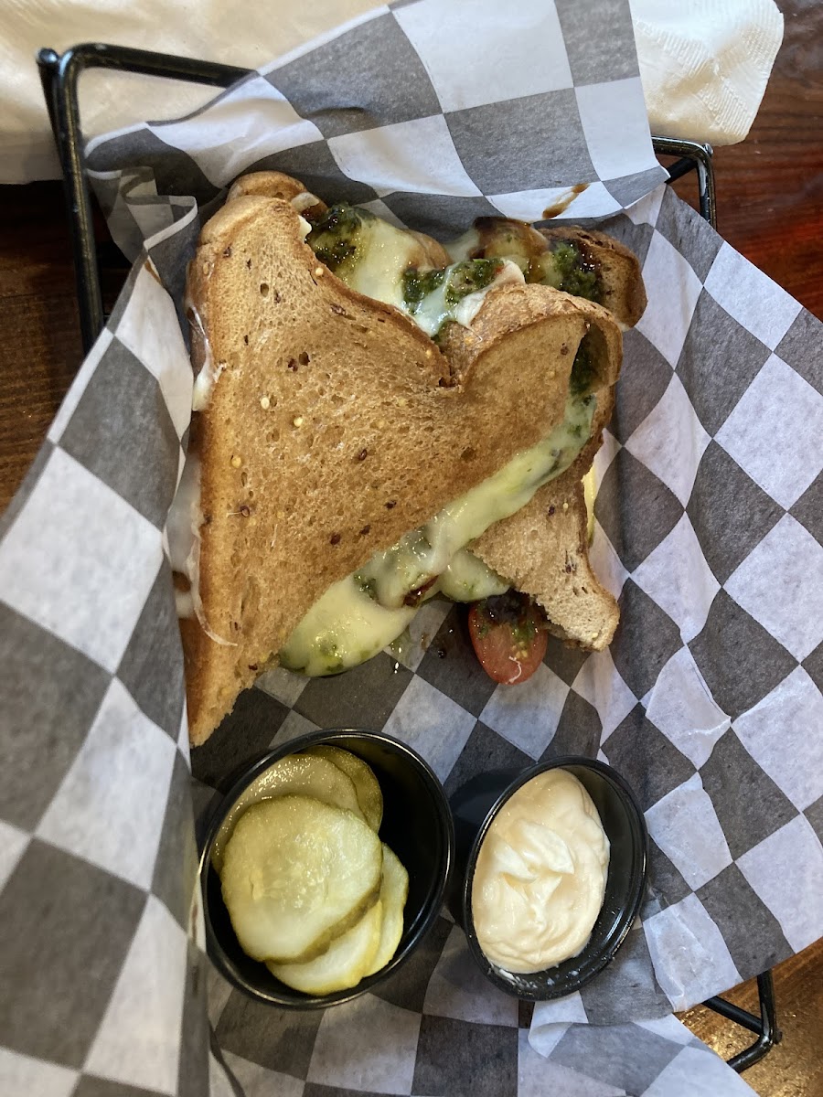 Margherita Grilled Cheese with chips and a pickle