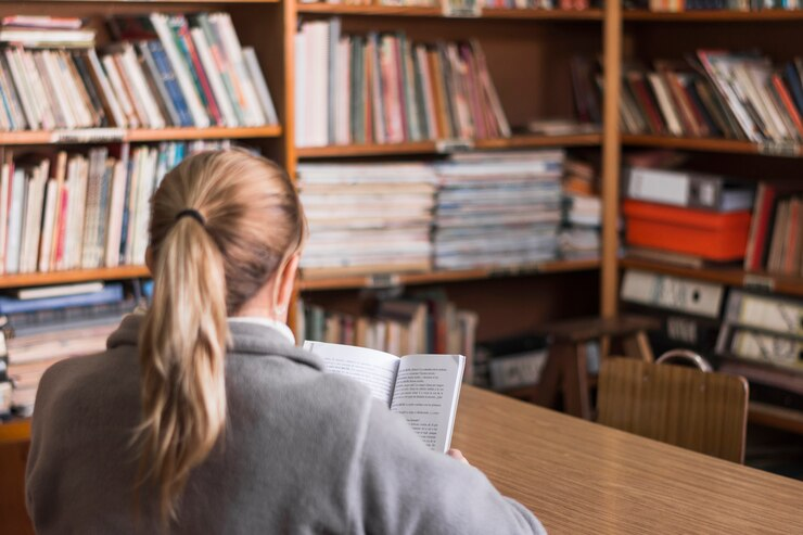 Birmingham Medical School student studying in the library.