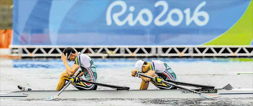 NO MEDAL: John Smith and James Thompson, right, of South Africa show their disappointment on missing out on a medal in the lightweight men's double sculls final Picture: GALLO IMAGES