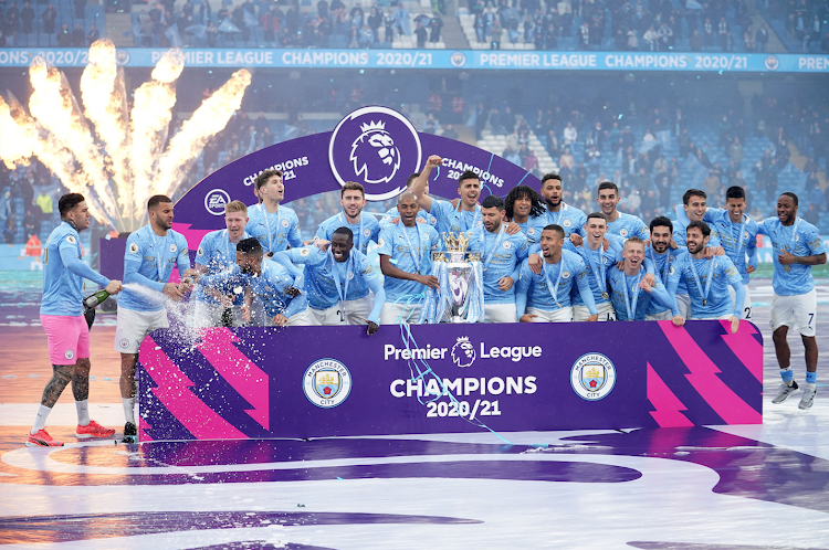 Manchester City' players celebrate after winning the 2020/21 Premier League title