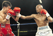 AT ARM'S LENGTH: Gideon Buthelezi, right, suffered a first-round knockout by Filipino   boxer Edrin Dapudong  in June PHOTO: Antonio Muchave