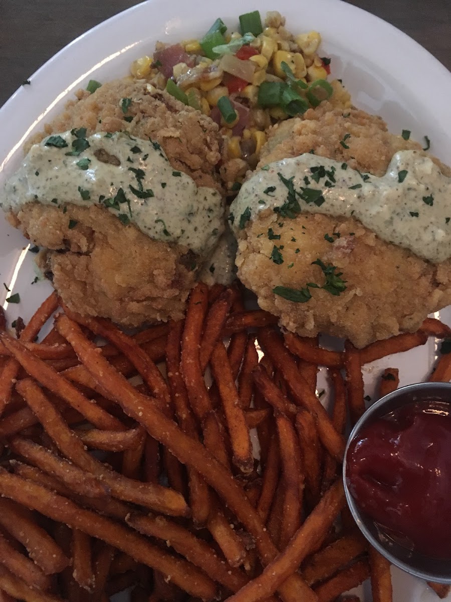 GF crab cakes with sweet potato fries! So good! The crab cakes were lightly battered and flakes easily with a fork!