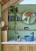 Use wall shelving to add both storage and visual interest to your bathroom.