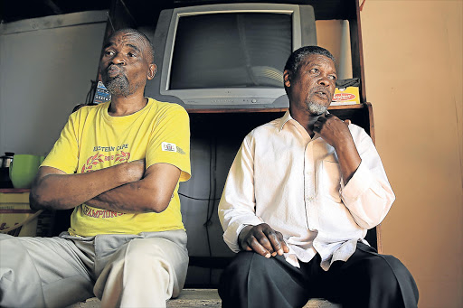 STRUGGLING: Uncle Mpumelelo Nongwevu with father and grandfather Thozamile Gijana speak to the media yesterday about the shack fire in Orange Grove that claimed the lives of five people. They want police to probe the circumstances. Below right, neighbour Ntobeko Sola said that they tried to help put out the fire but it was too late Picture: MARK ANDREWS