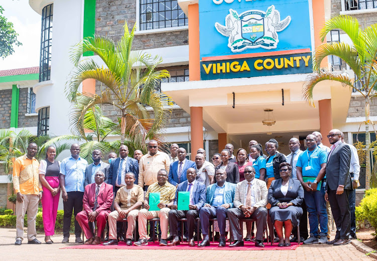 A joint picture of Shofco officials and those from county government of Vihiga after the signing of MoU by CEO Kennedy Odede and Governor Wilber Ottichilo.