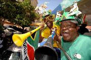 Mzion Mofokeng no1 Pirates supporter and Saddam Maake no 1 Chiefs supporter and both are die-hard Bafana maniacs, seen here on the Siyangqoba bus.