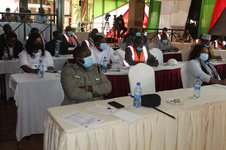 Participants follow proceedings during the commemoration of 16 days of activism against GBV in Nyeri town on Friday.