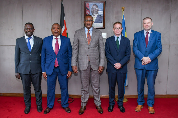 Cabinet Secretary for Information, Communications and the Digital Economy Eliud Owalo, UK Ambassador to Kenya, Neil Wigan and other officials pose for a photo after a formal meeting on May 20, 2024.