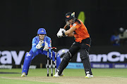 Aiden Markram of Sunrisers Eastern Cape plays a stroke with MI Cape Town wicketkeeper Grant Roelofsen looking on in the Betway SA20 match at St George's Park in Gqeberha on January 16 2023.