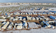 A picture taken with a drone shows a partially snow covered camp for internally displaced people, in northern Aleppo countryside, Syria January 19, 2022.