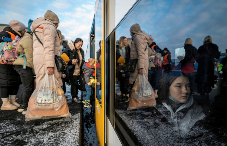 People fleeing Russian invasion of Ukraine change trains at Euroterminal to be transferred to temporary accommodation centres around the country, in Slawkow, Poland, on March 5 2022. Picture: AGENCJA WYBORCZA via REUTERS/GRZEGORZ