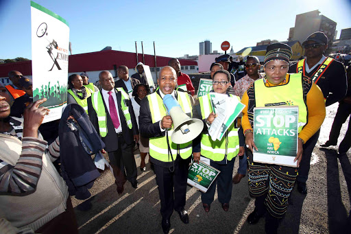 SPEAKING OUT: MEC Pemmy Majodina, second from right, with speaker Luleka Simon, back, mayor Zukiswa Ncitha and Eastern Cape premier, Phumulo Masualle, who walked about in the East London CBD yesterday speaking to people about the spate of xenophobic attacks in the country Picture: MARK ANDREWS