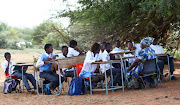 NOT-SO-GREAT OUTDOORS Pupils at Makangwane Secondary in Limpopo are studying under trees because their school building is falling apart. 