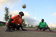 A victim of polio heads the ball during a game of soccer in Abuja, Nigeria, on August 22 2020. The world is at a 'dangerous moment' in the fight against diseases like polio, a senior WHO official has warned, as efforts begin to immunise 23-million children in five African countries after a case in Malawi. File photo.