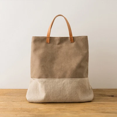 Sac bandoulière femme à une épaule, portable et grand en tissu. Idéal pour transporter vos affaires avec style et confort. Grande capacité.